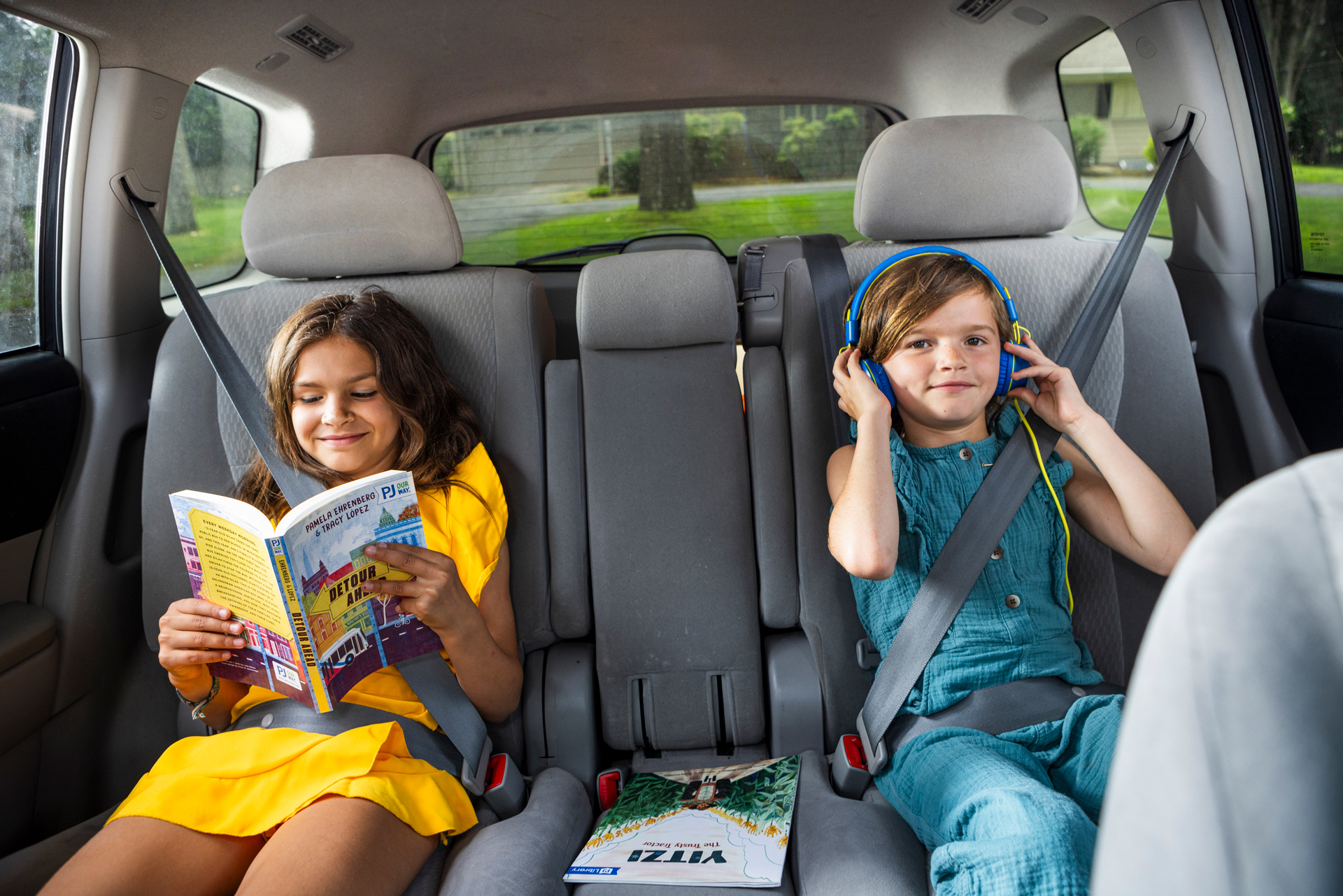 kids_enjoying_podcast_book_in_car.jpg