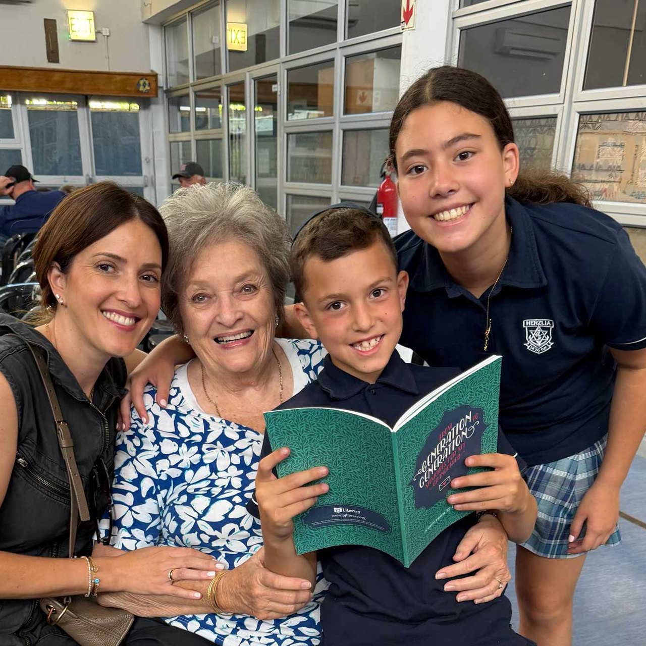 family_smiles_with_book.jpg