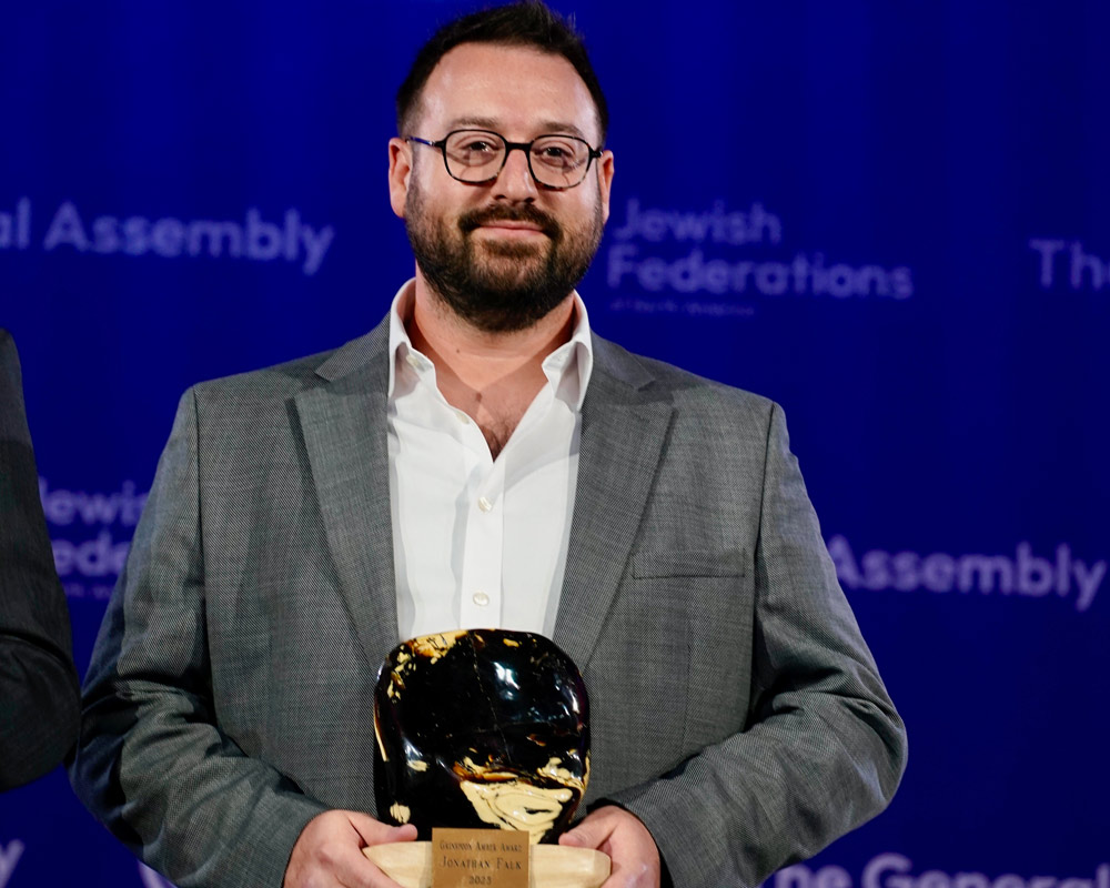 Jonathan_Falk_Holding_Amber_Award.jpg