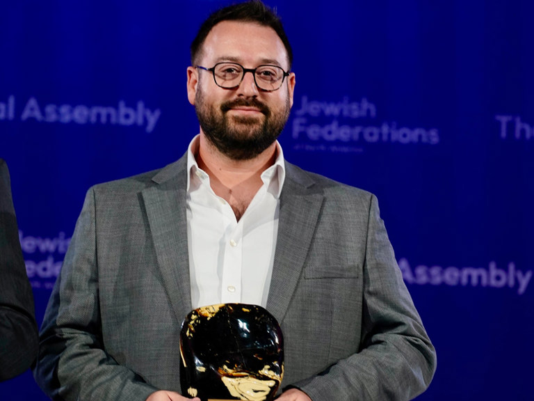 Jonathan_Falk_Holding_Amber_Award.jpg